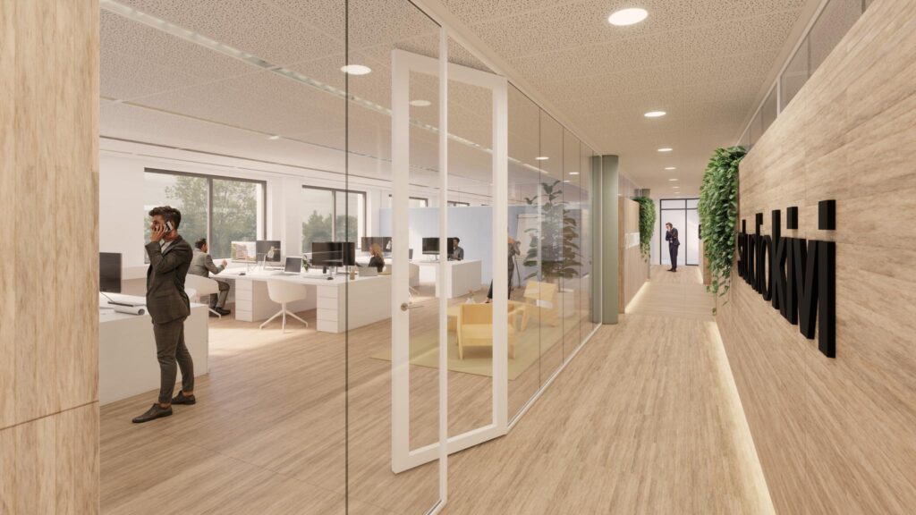 Moderne kantoorruimte aan de Prof. W.H. Keesomlaan met glazen wanden, houten vloer en mensen aan het werk bij Studio Kivi.